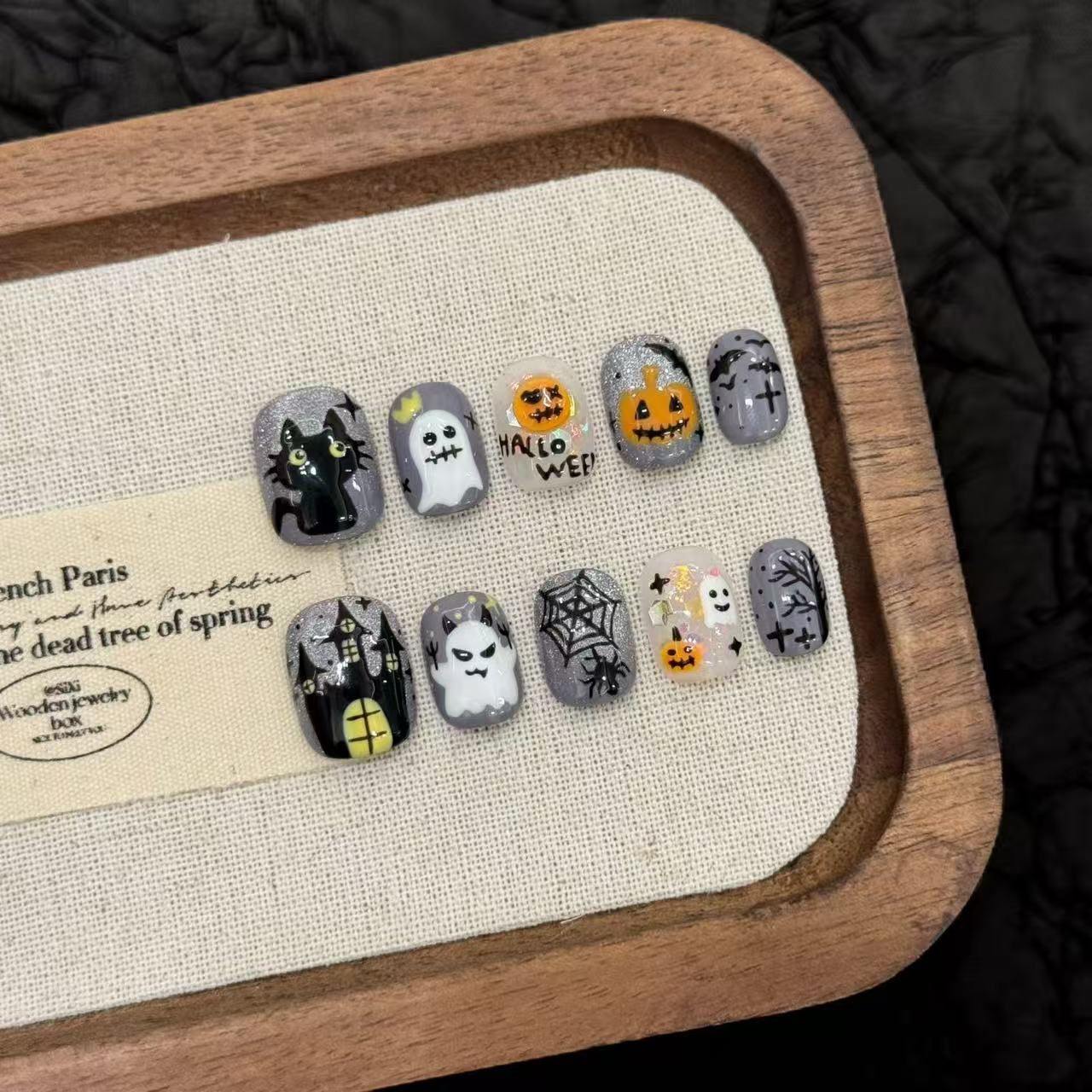 Halloween-themed press-on nail set with pumpkins, ghosts and raised details