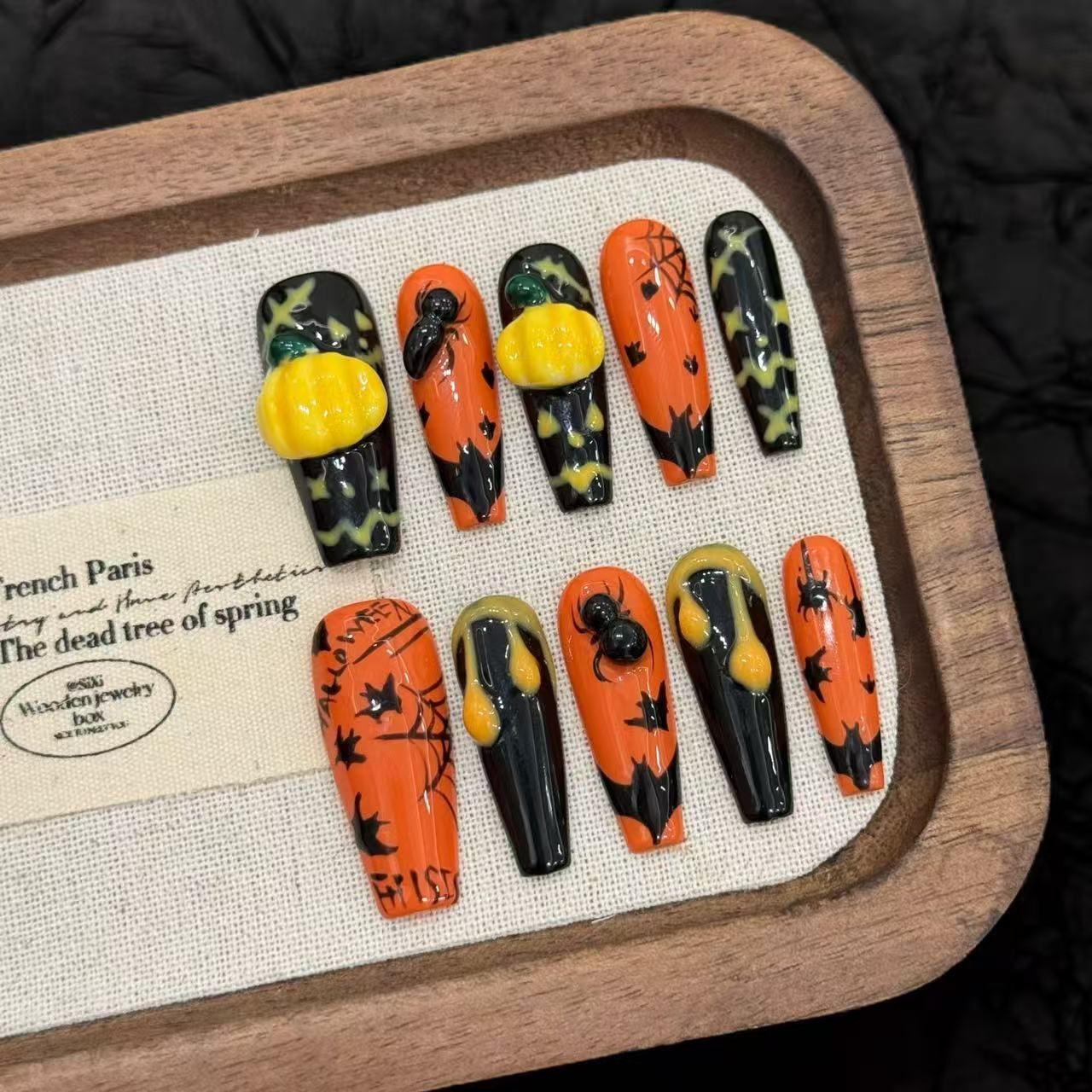 3D pumpkin art press-on nails with glossy gel finish, spiders, bats and spiderwebs in orange and black
