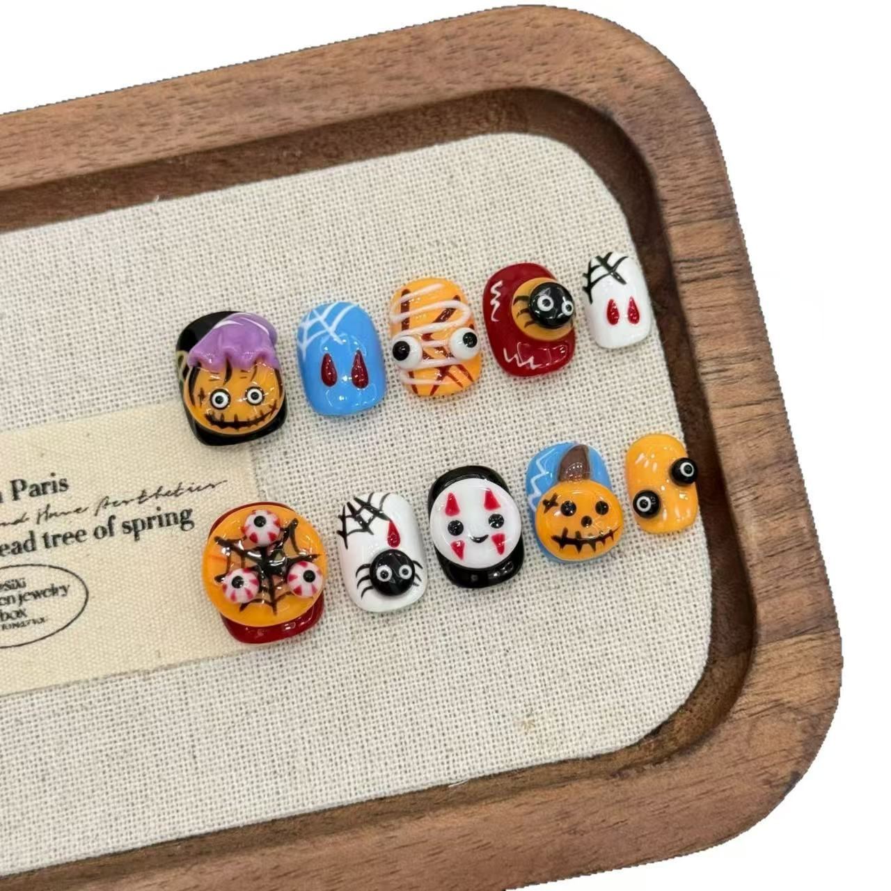 Kawaii Halloween press-on nails with pumpkins, mummies and spider designs